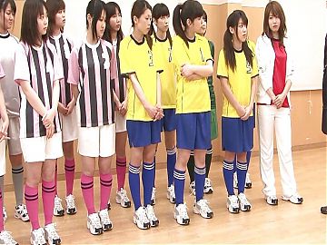 Japanese female team listen and take a lesson from their coach